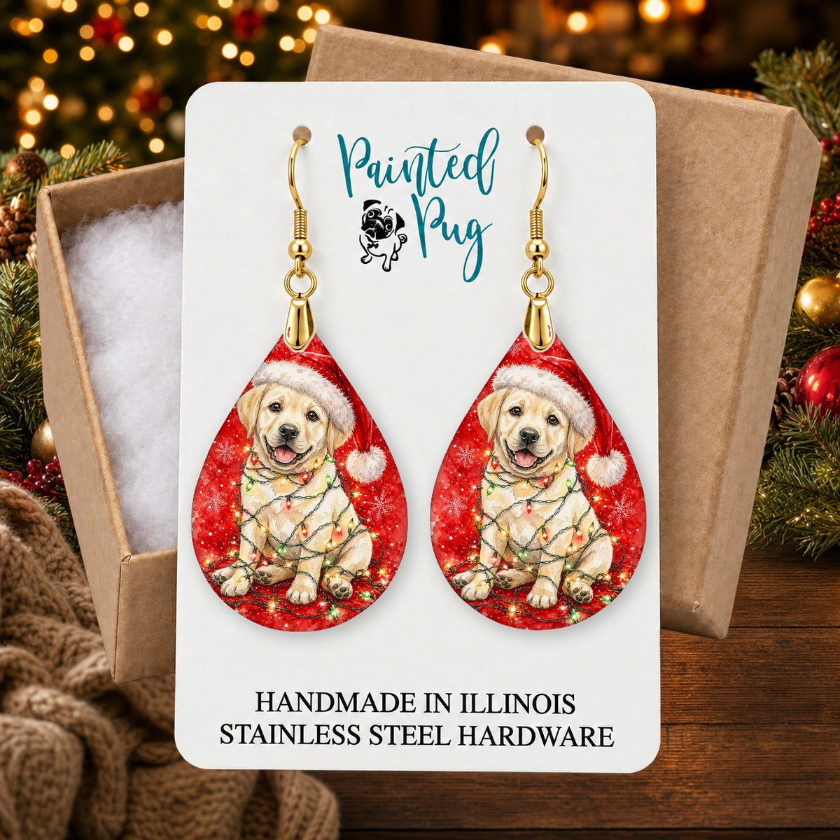 Yellow Lab Christmas Lights earrings in a gift box on a Christmas table