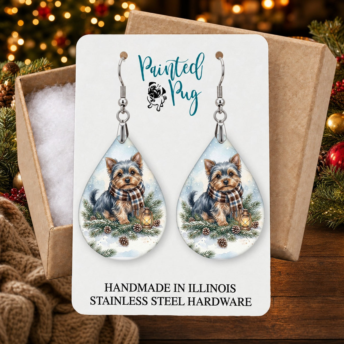 Yorkie Winter Woodland earrings in a gift box on a Christmas table