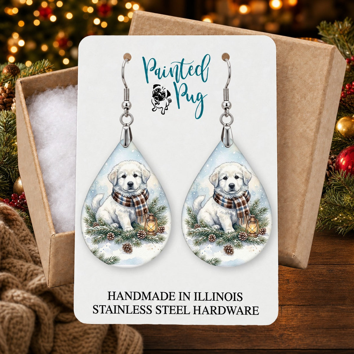 Great Pyrenees Winter Woodland earrings in a gift box on a Christmas table