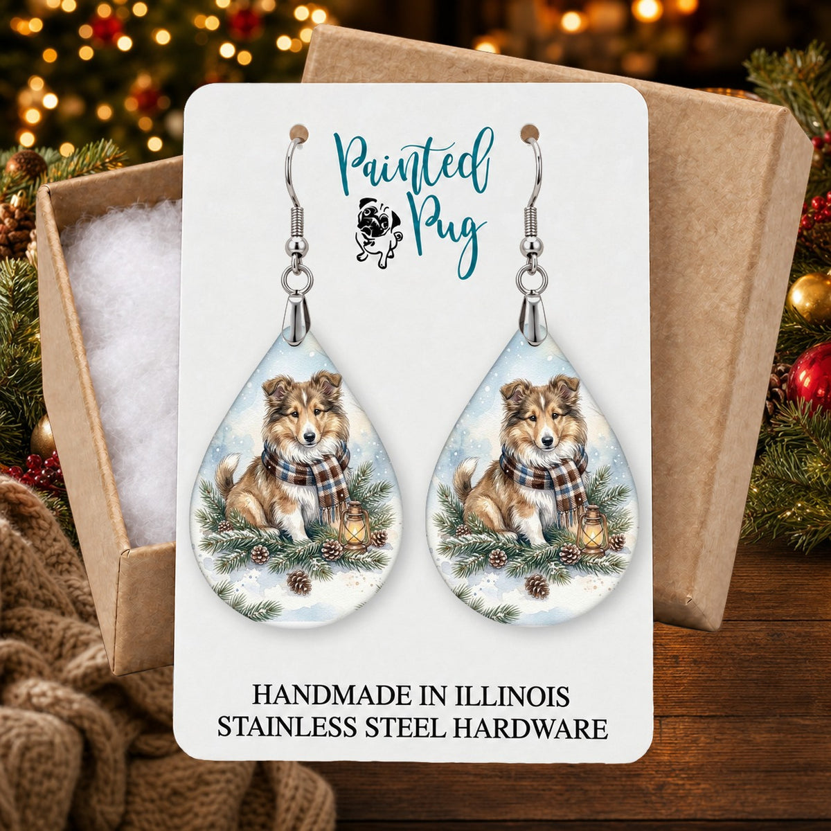 Collie Winter Woodland earrings in a gift box on a Christmas table