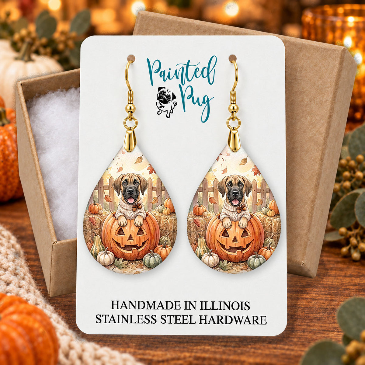 Great Dane pumpkin teardrop earrings gift boxed on a cozy fall background
