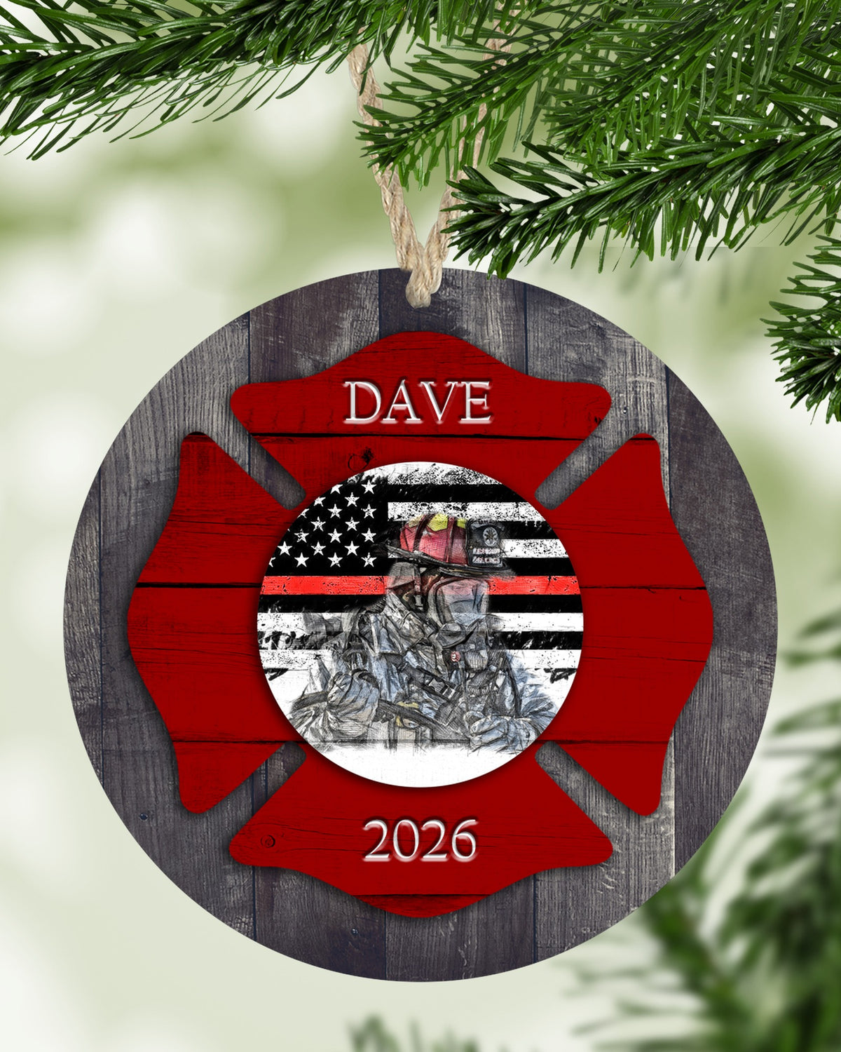 Personalized firefighter Christmas ornament hanging on a Christmas tree - The Painted Pug