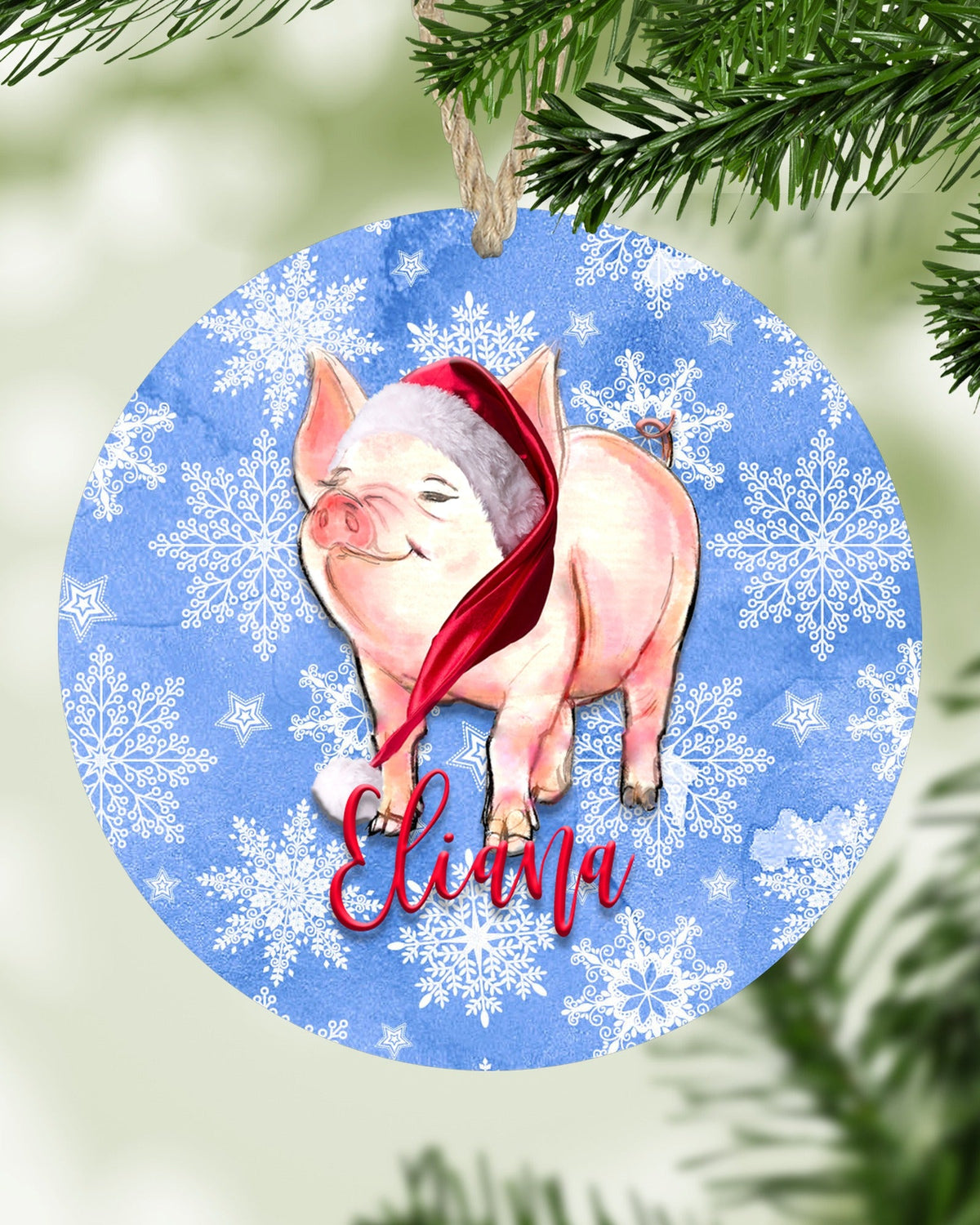 Personalized pig Christmas ornament hanging on a Christmas tree - The Painted Pug