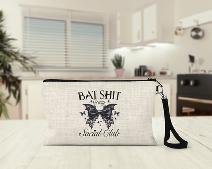 Bat Crazy Social Club Makeup Bag on a kitchen counter