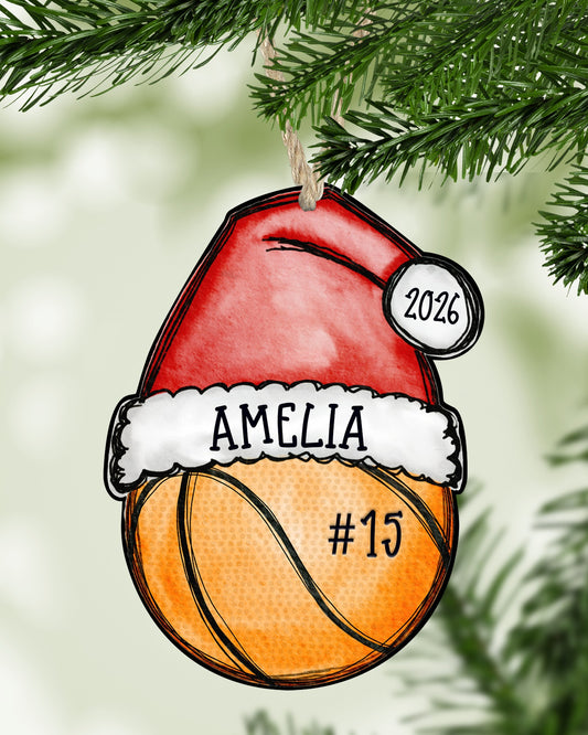 Personalized basketball Christmas ornament hanging on a Christmas tree - The Painted Pug