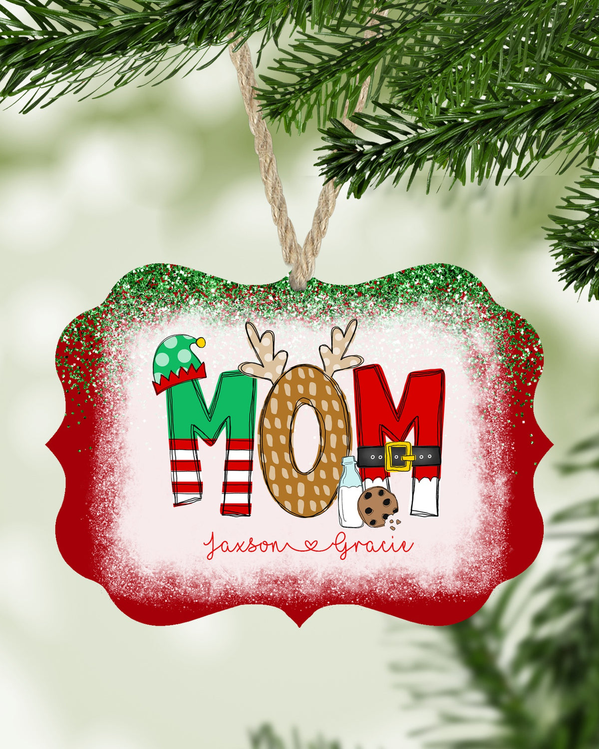 Personalized Mom Christmas ornament with kids names hanging on a Christmas tree - The Painted Pug