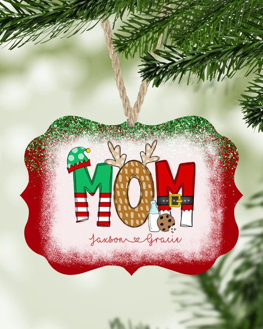Personalized Mom Christmas ornament with kids names hanging on a Christmas tree - The Painted Pug
