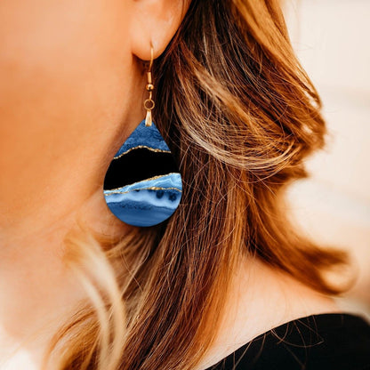 Blue and Gold Teardrop Earrings close-up on model