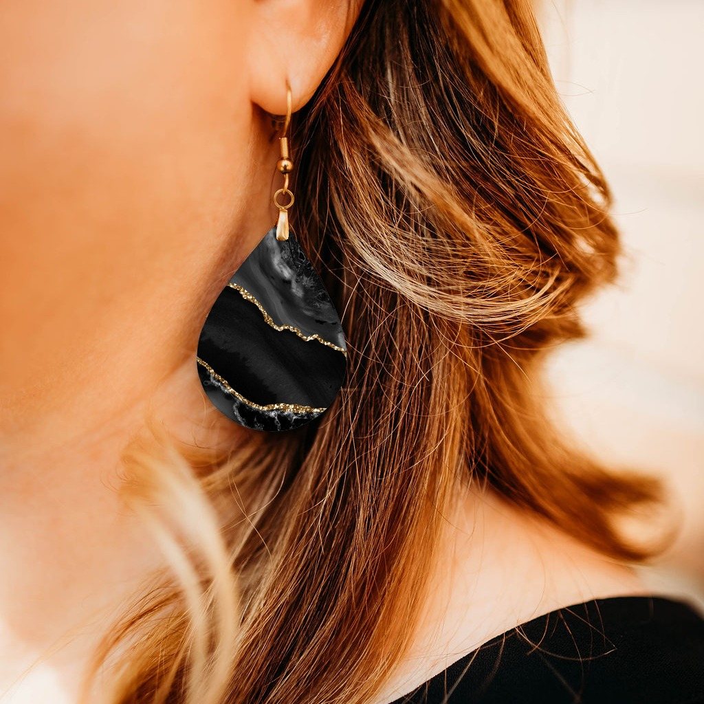 Black and Gold Teardrop Earrings close-up on model