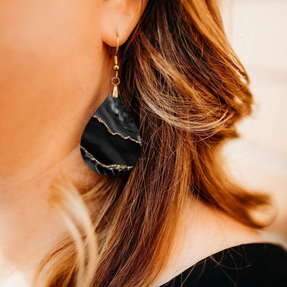 Black and Gold Teardrop Earrings close-up on model