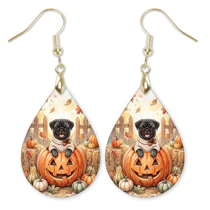 Black pug in a jack-o-lantern teardrop earrings with gold hooks