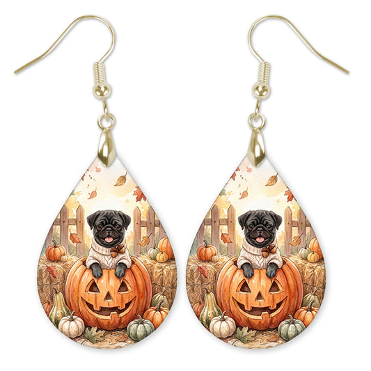 Black pug in a jack-o-lantern teardrop earrings with gold hooks