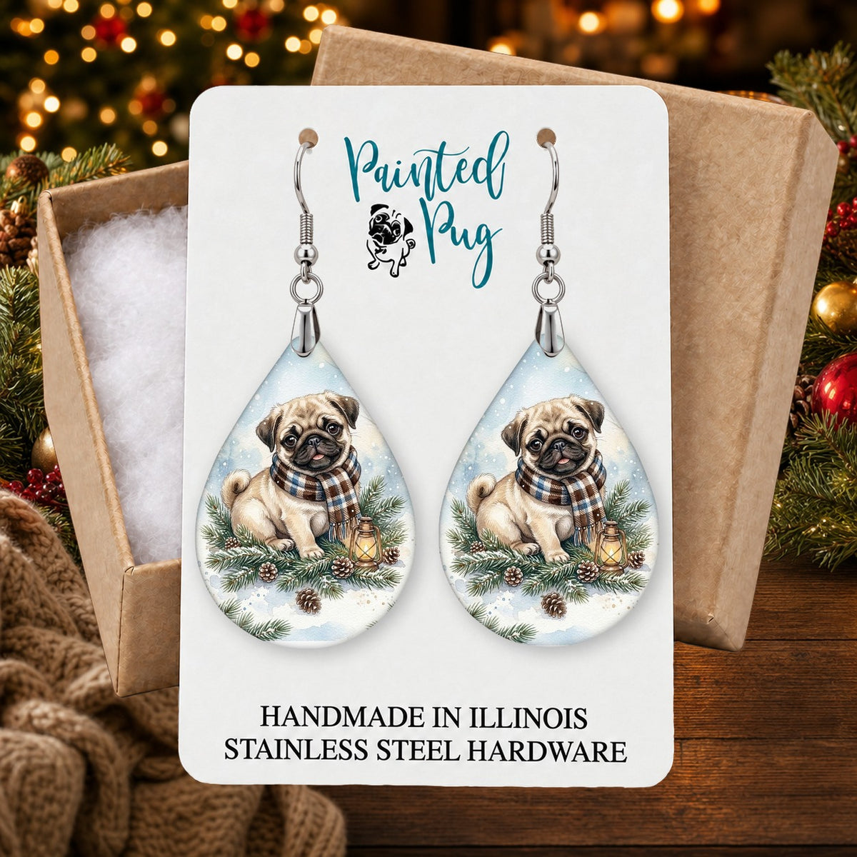 Fawn Pug Winter Woodland earrings in a gift box on a Christmas table