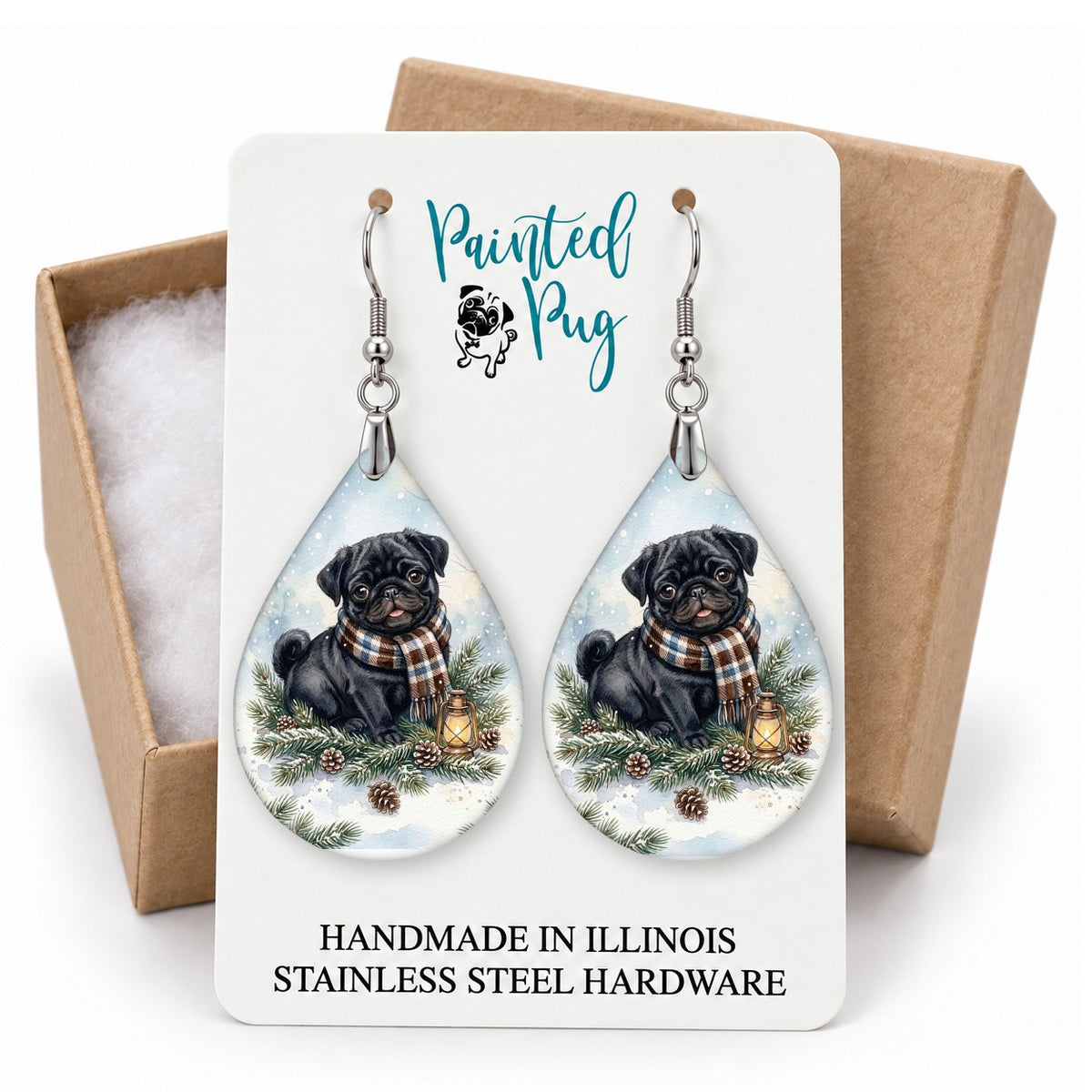 Black Pug Winter Woodland teardrop earrings on a gift box card