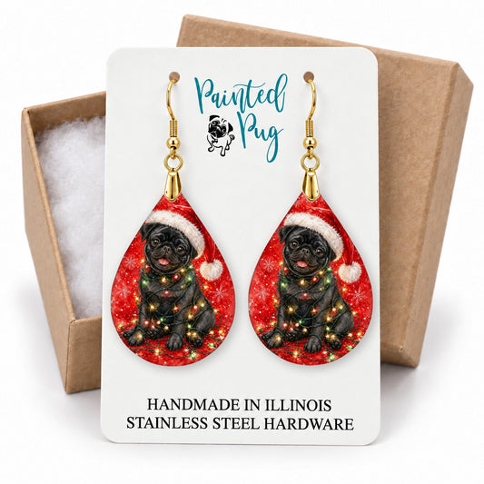 Black Pug Christmas Lights teardrop earrings on a gift box card