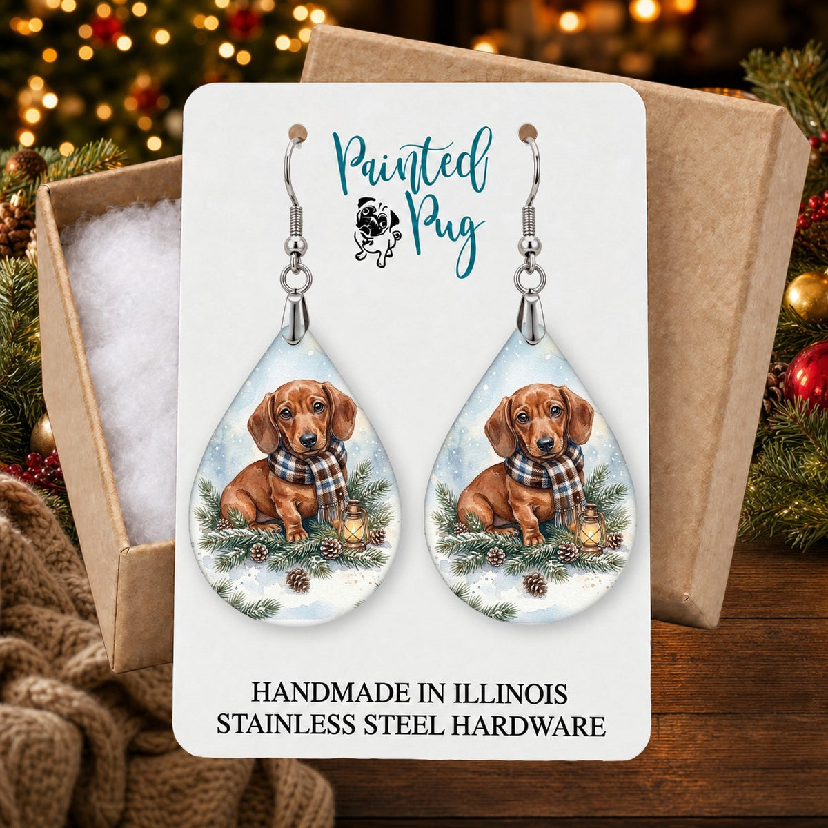 Dachshund Winter Woodland earrings in a gift box on a Christmas table