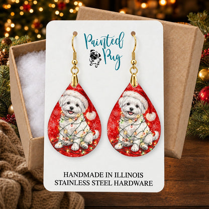 Maltese Christmas Lights earrings in a gift box on a Christmas table