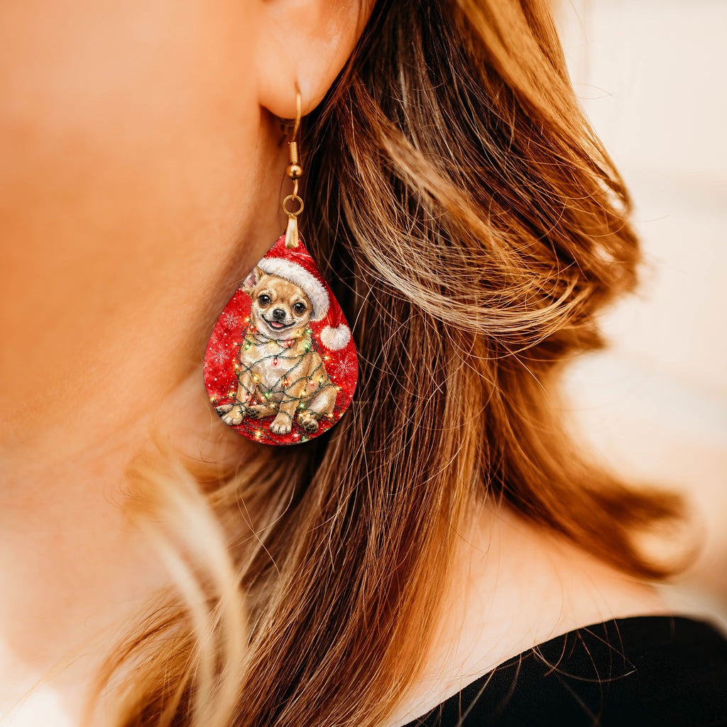 Chihuahua Christmas Lights teardrop earrings worn by a model, close-up