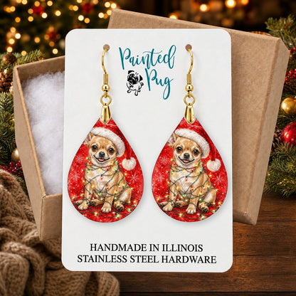Chihuahua Christmas Lights earrings in a gift box on a Christmas table