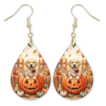 Yellow Lab in a cream sweater on a jack-o'-lantern teardrop earrings with gold-tone hooks