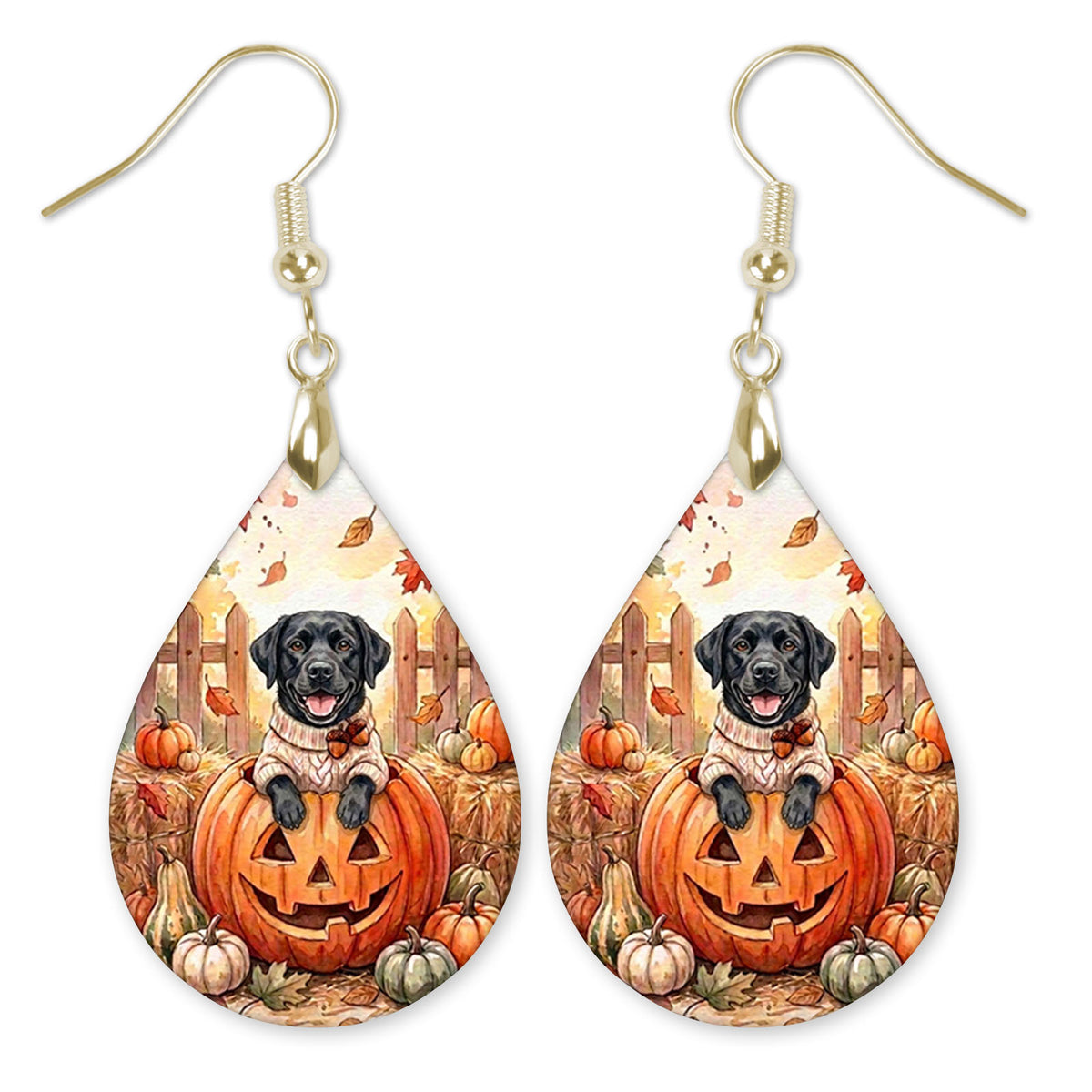 Black Lab in a cream sweater on a jack-o'-lantern teardrop earrings with gold-tone hooks