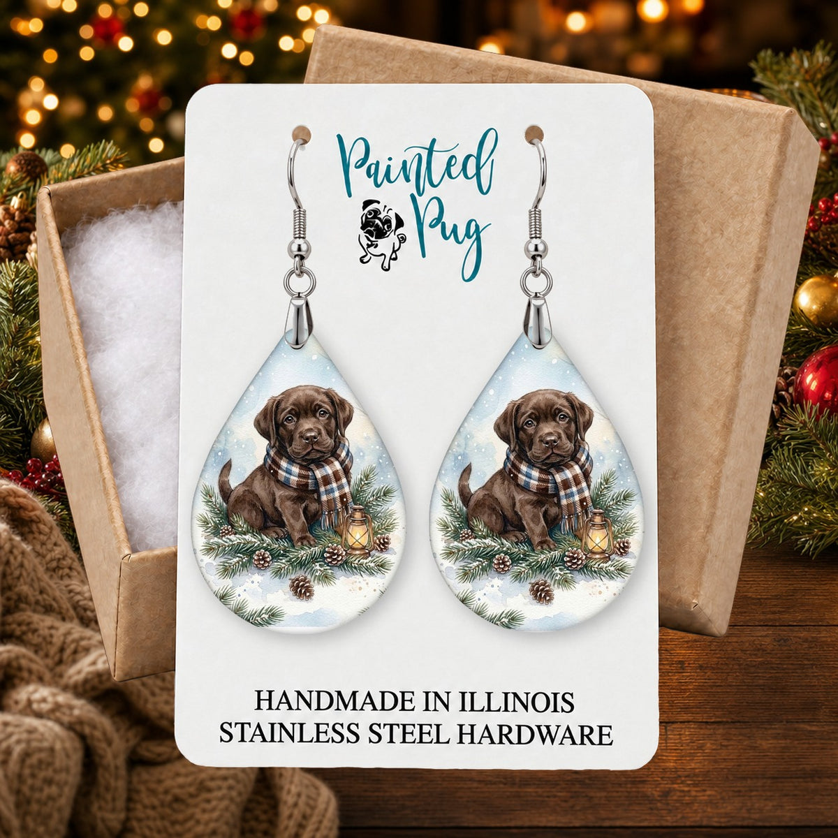 Chocolate Lab Winter Woodland earrings in a gift box on a Christmas table