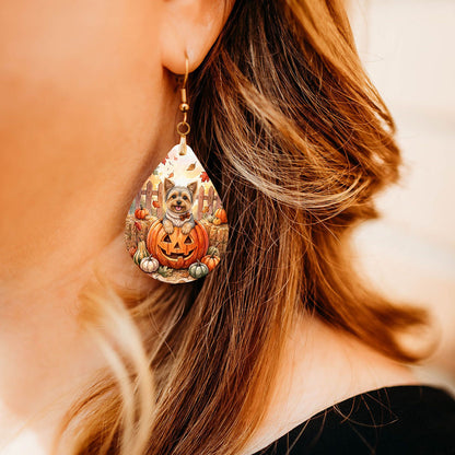 Model wearing Yorkie pumpkin teardrop earrings
