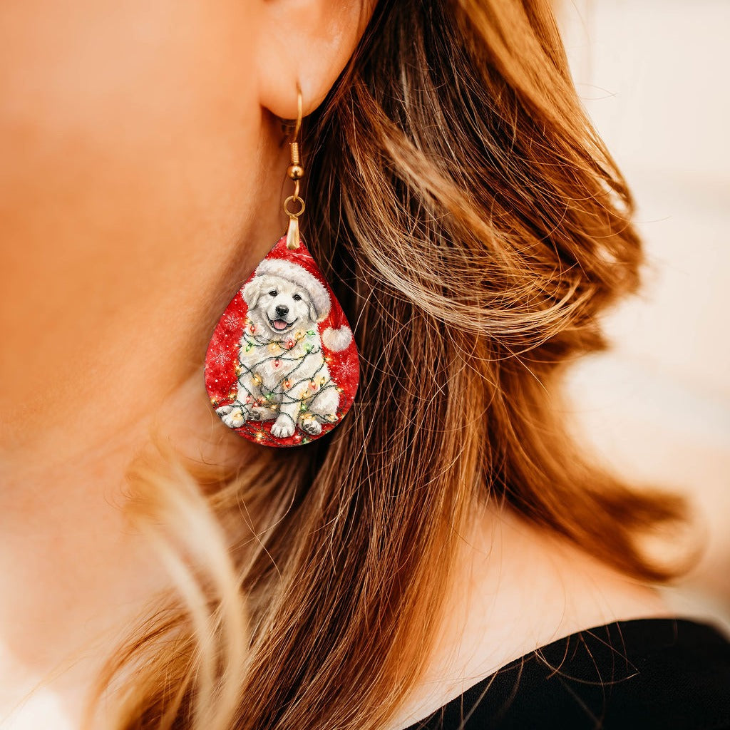 Great Pyrenees Christmas Lights teardrop earrings worn by a model, close-up