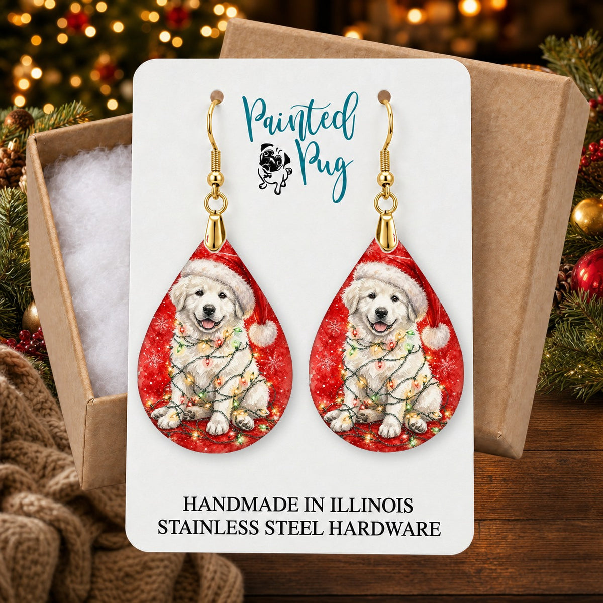 Great Pyrenees Christmas Lights earrings in a gift box on a Christmas table
