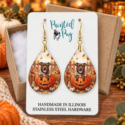 Pitbull pumpkin teardrop earrings gift boxed on a cozy fall background