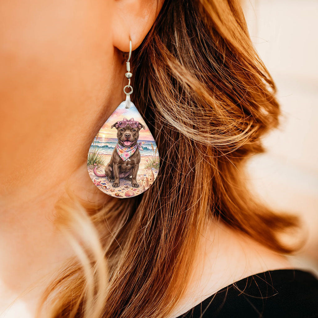 Model wearing pitbull beach teardrop earrings