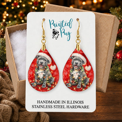 Pitbull Christmas Lights earrings in a gift box on a Christmas table