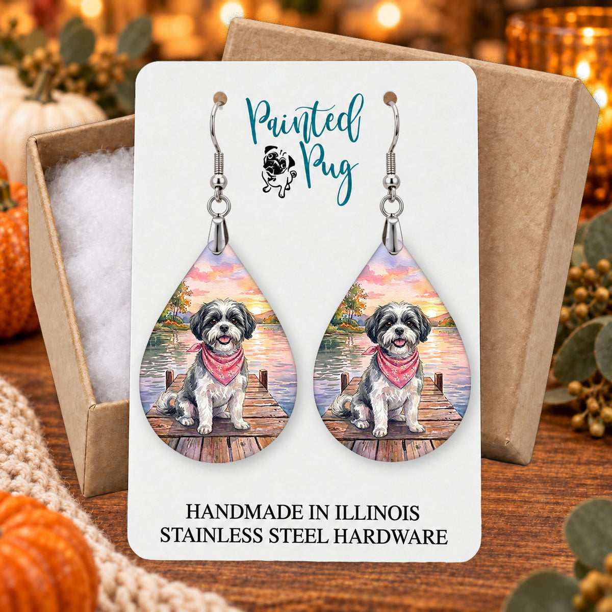 Black and White Shih Tzu lake teardrop earrings gift boxed on a seasonal background