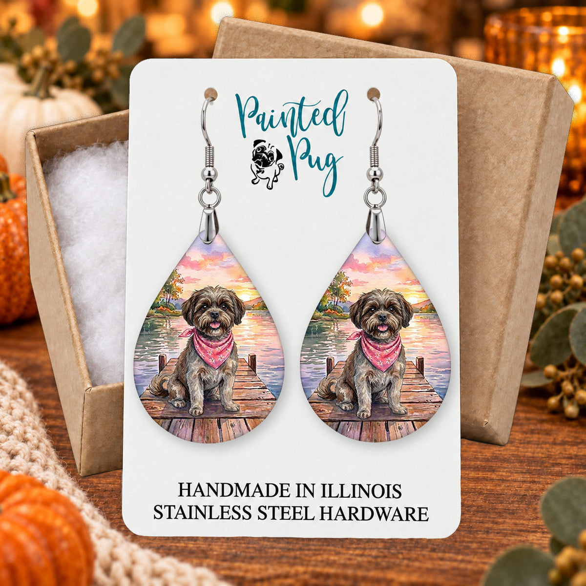 Brown Shih Tzu lake teardrop earrings gift boxed on a seasonal background