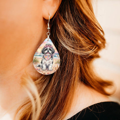 Model wearing black-and-white shih tzu beach teardrop earrings