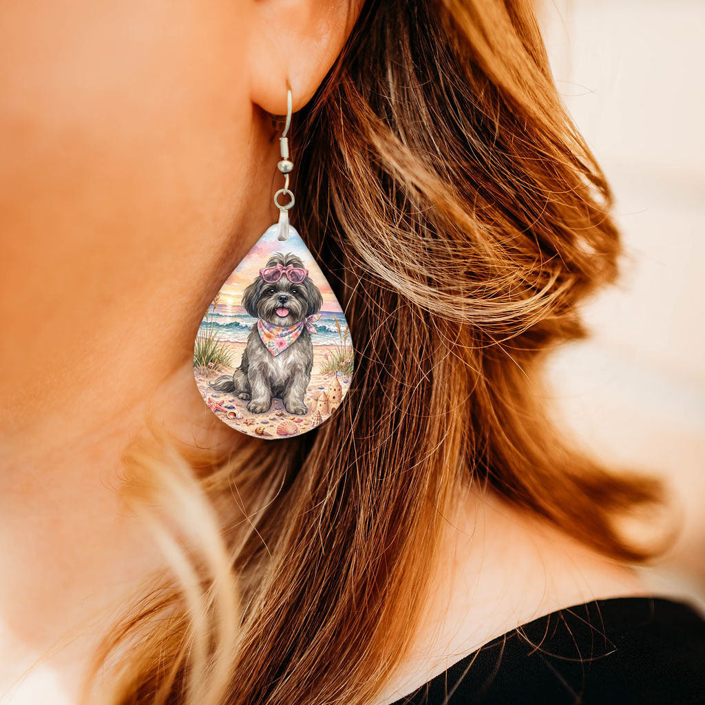 Model wearing grey shih tzu beach teardrop earrings
