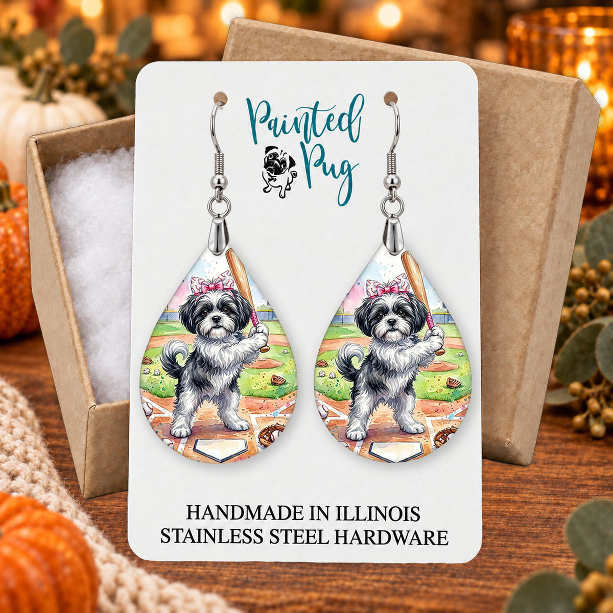 Black and White Shih Tzu baseball teardrop earrings gift boxed on a seasonal background