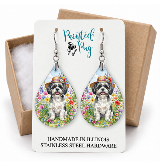 Black and White Shih Tzu wildflower teardrop earrings on a Painted Pug earring card with a kraft gift box