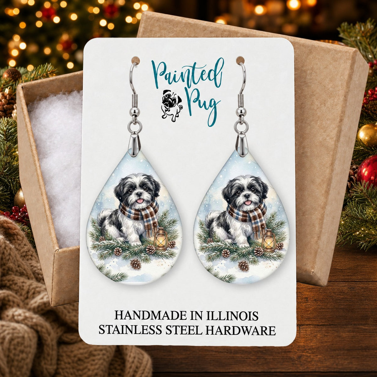 Black and White Shih Tzu Winter Woodland earrings in a gift box on a Christmas table