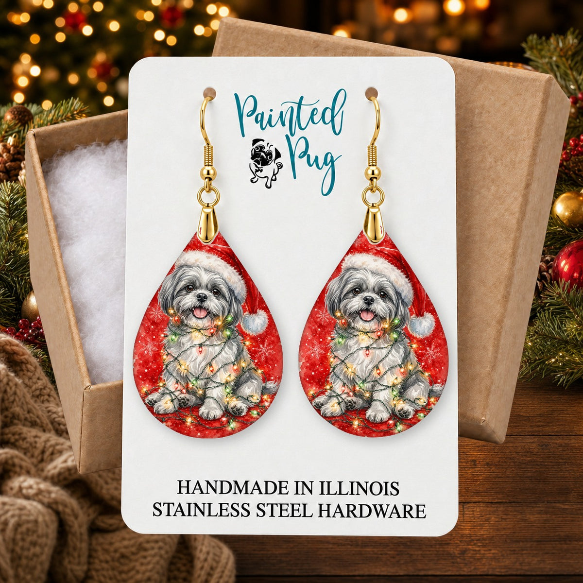 Grey Shih Tzu Christmas Lights earrings in a gift box on a Christmas table
