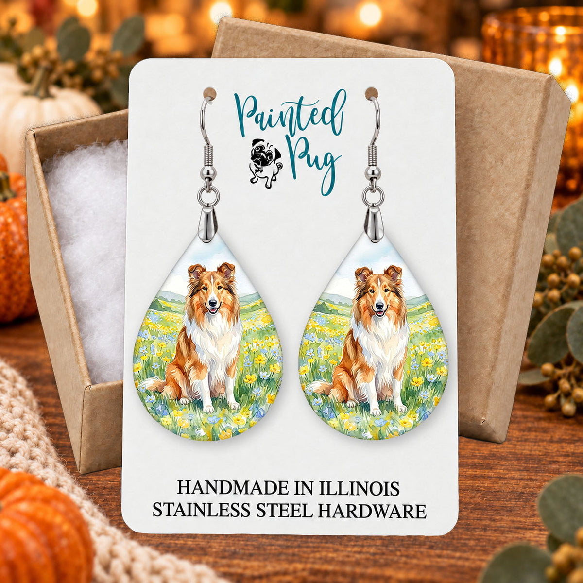 Collie spring meadow teardrop earrings gift boxed on a seasonal background