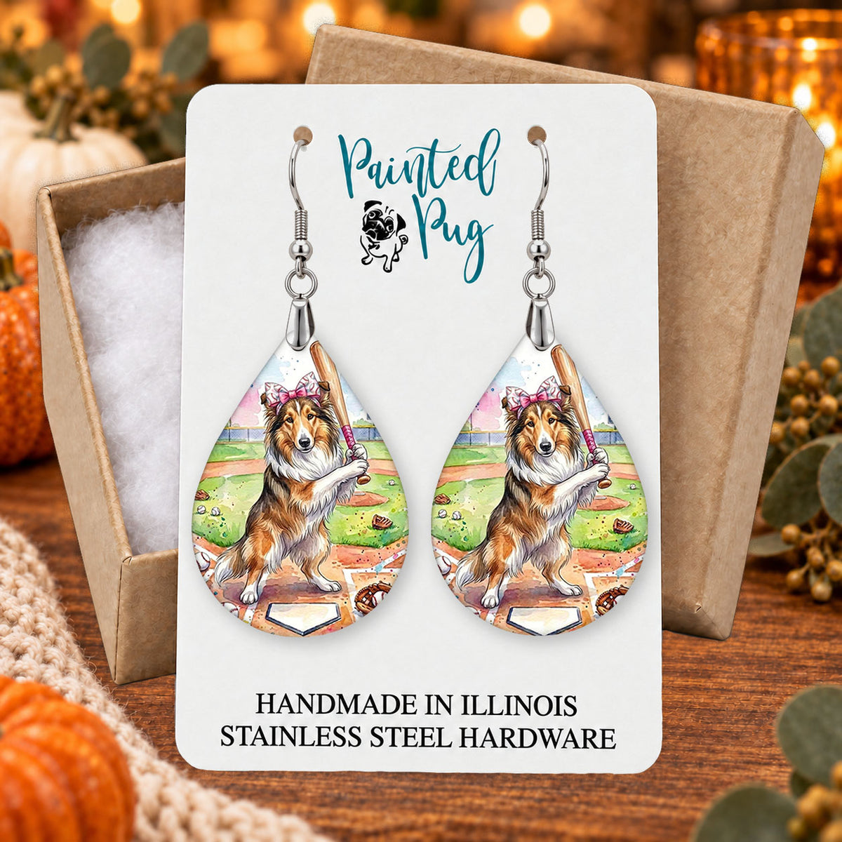 Collie baseball teardrop earrings gift boxed on a seasonal background