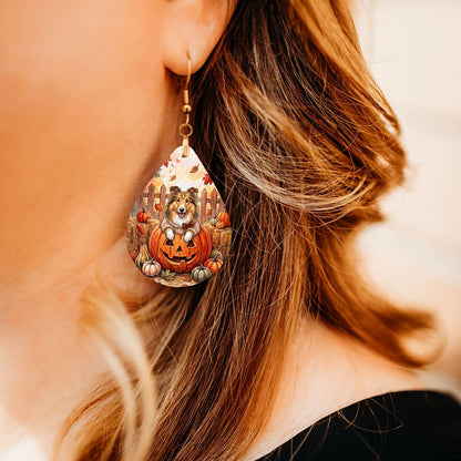 Model wearing collie pumpkin teardrop earrings