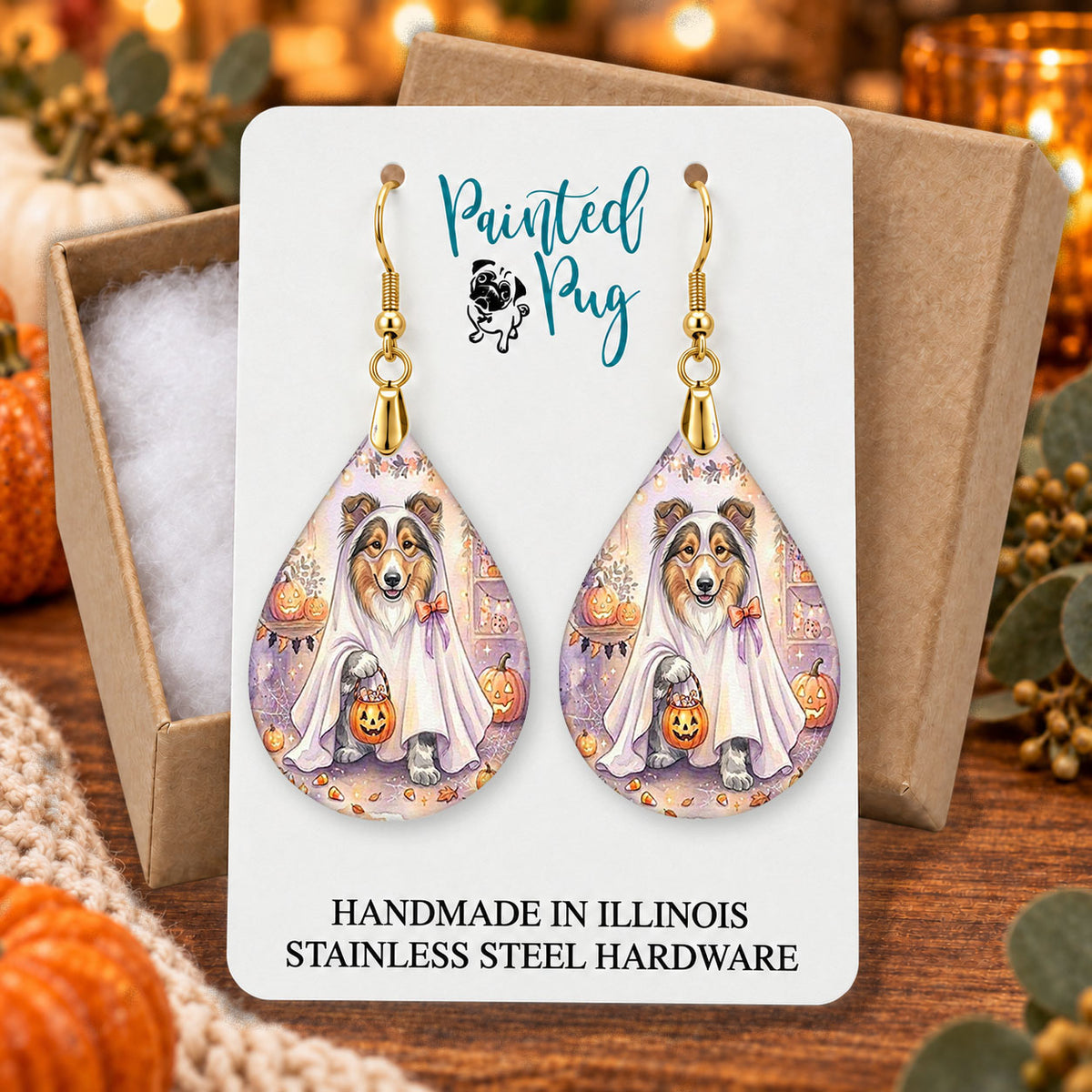 Collie ghost teardrop earrings gift boxed on a cozy fall background
