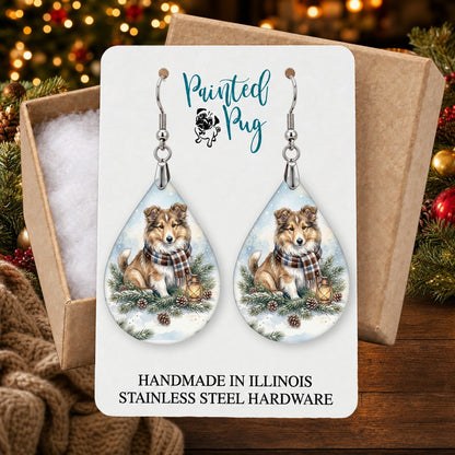 Collie Winter Woodland earrings in a gift box on a Christmas table