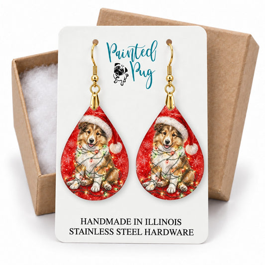 Collie Christmas Lights teardrop earrings on a gift box card