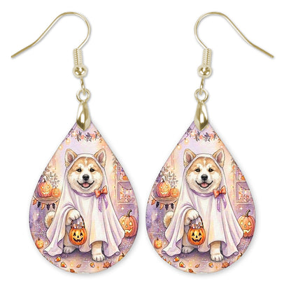 Akita in a ghost costume with a candy bucket teardrop earrings with gold-tone hooks