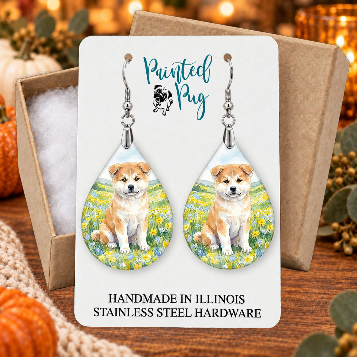 Akita spring meadow teardrop earrings gift boxed on a seasonal background