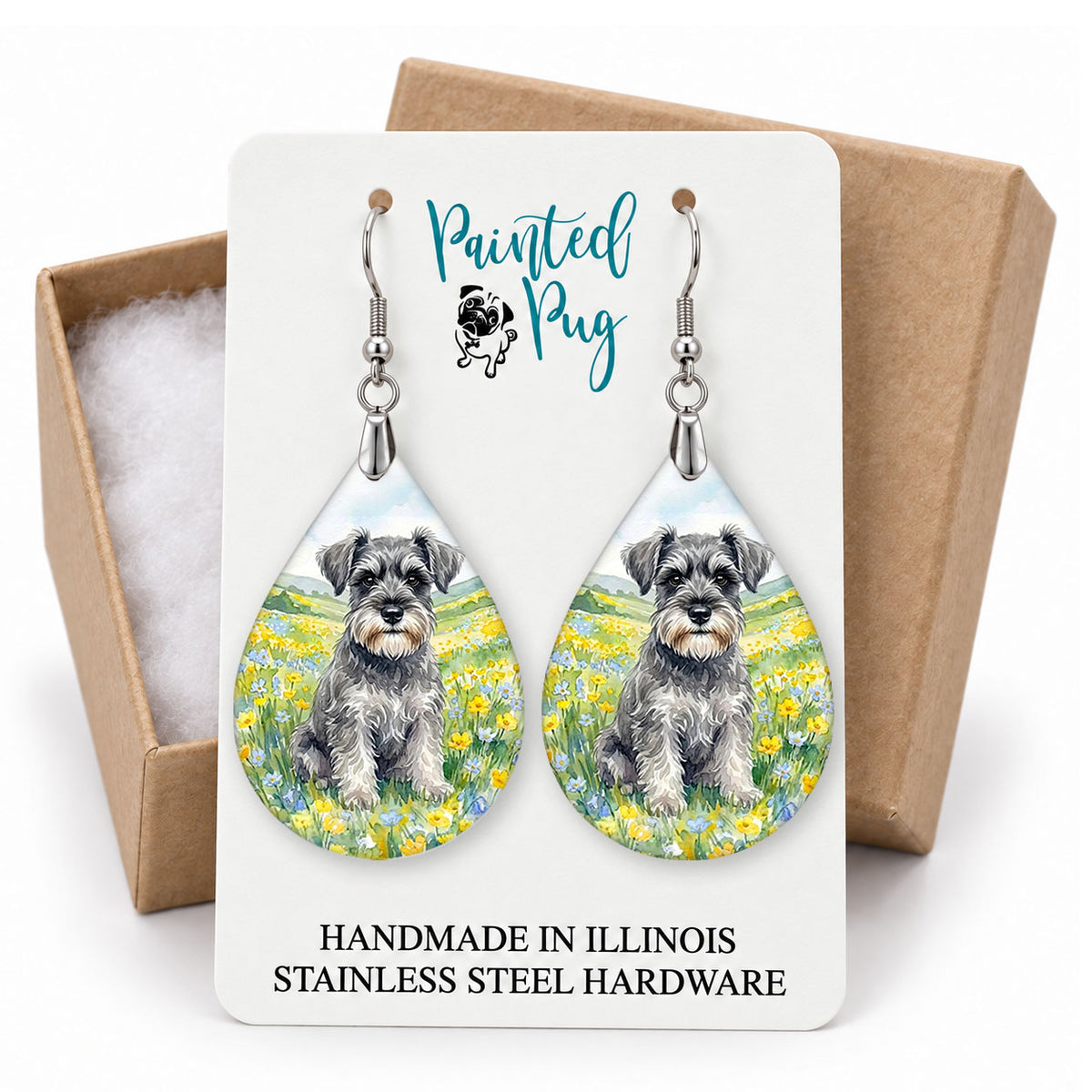 Schnauzer spring meadow teardrop earrings on a Painted Pug earring card with a kraft gift box