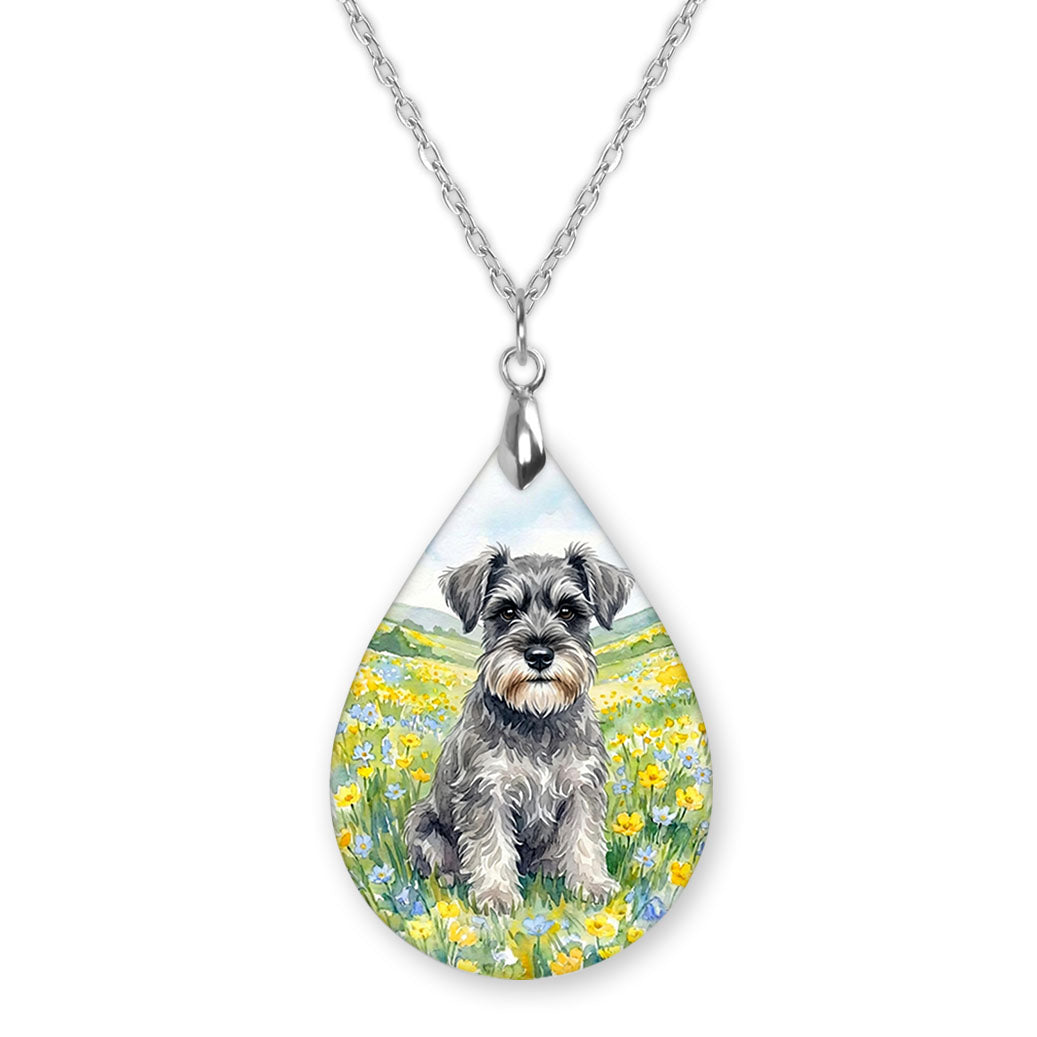 Schnauzer spring meadow teardrop pendant necklace on a silver-tone chain